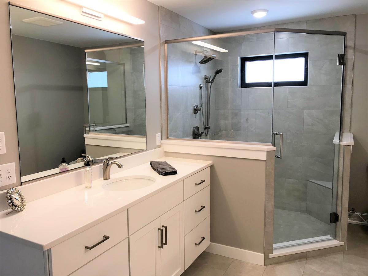 Ross Construction-designed master bathroom in Marathon, WI with glass shower and single sink vanity.