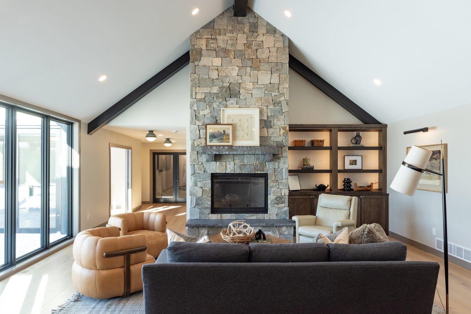 Front-facing view of great room fireplace in custom home by Ross Construction in Rib Mountain, WI.