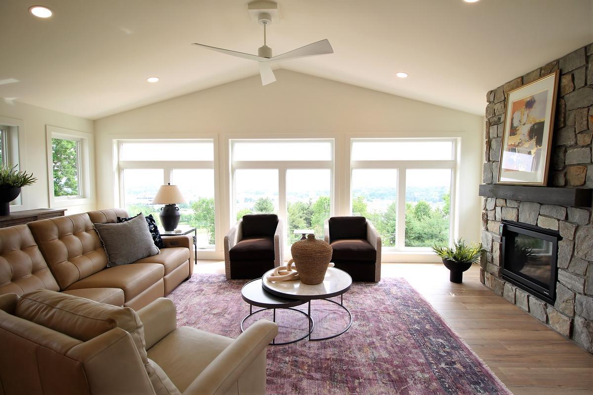 Bright living space with picture windows and stone fireplace in a Ross Construction custom home in Marathon, WI. Bright living space with picture windows and stone fireplace in a Ross Construction custom home in Marathon, WI.